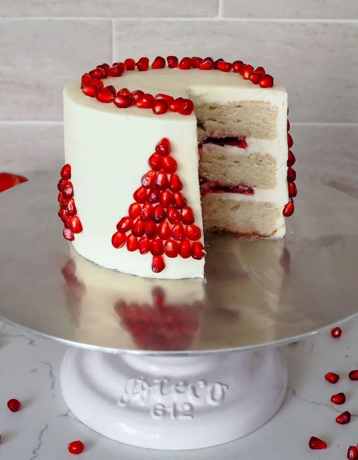 I Used Pomegranate Arils To Make Christmas Trees On The Side Of This White Chocolate Pomegranate Cake, And It Turned Out So Cute
