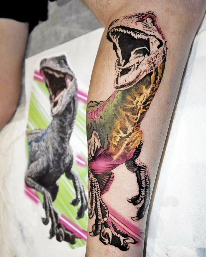 Colorful dinosaur tattoo on forearm, showcasing intricate design and detail from an executed tattoo idea.