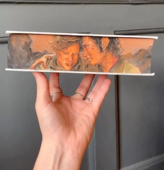 30 Magical Drawings On The Edges Of Popular Books Featuring Famous Scenes Done By This Artist