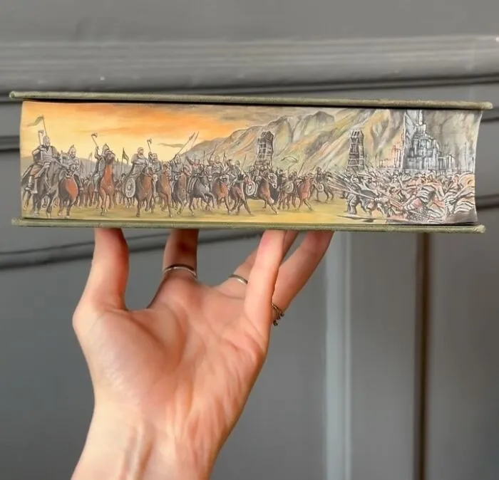 30 Magical Drawings On The Edges Of Popular Books Featuring Famous Scenes Done By This Artist