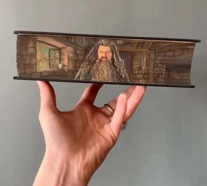 30 Magical Drawings On The Edges Of Popular Books Featuring Famous Scenes Done By This Artist