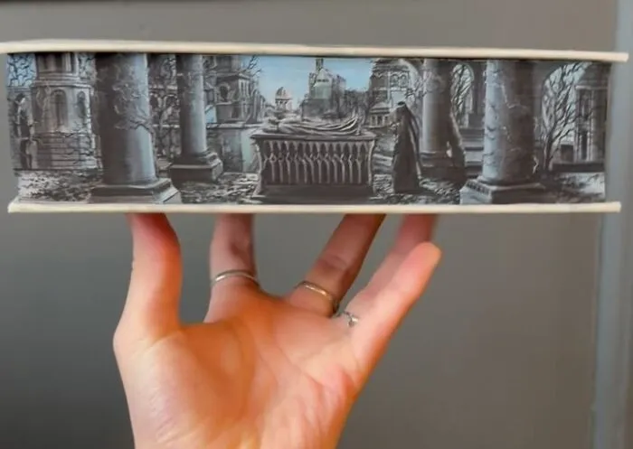 30 Magical Drawings On The Edges Of Popular Books Featuring Famous Scenes Done By This Artist