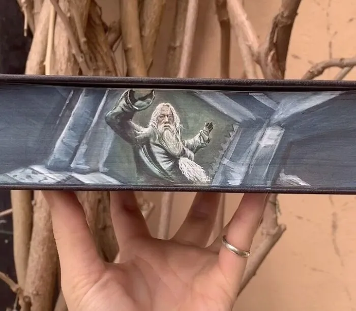 30 Magical Drawings On The Edges Of Popular Books Featuring Famous Scenes Done By This Artist
