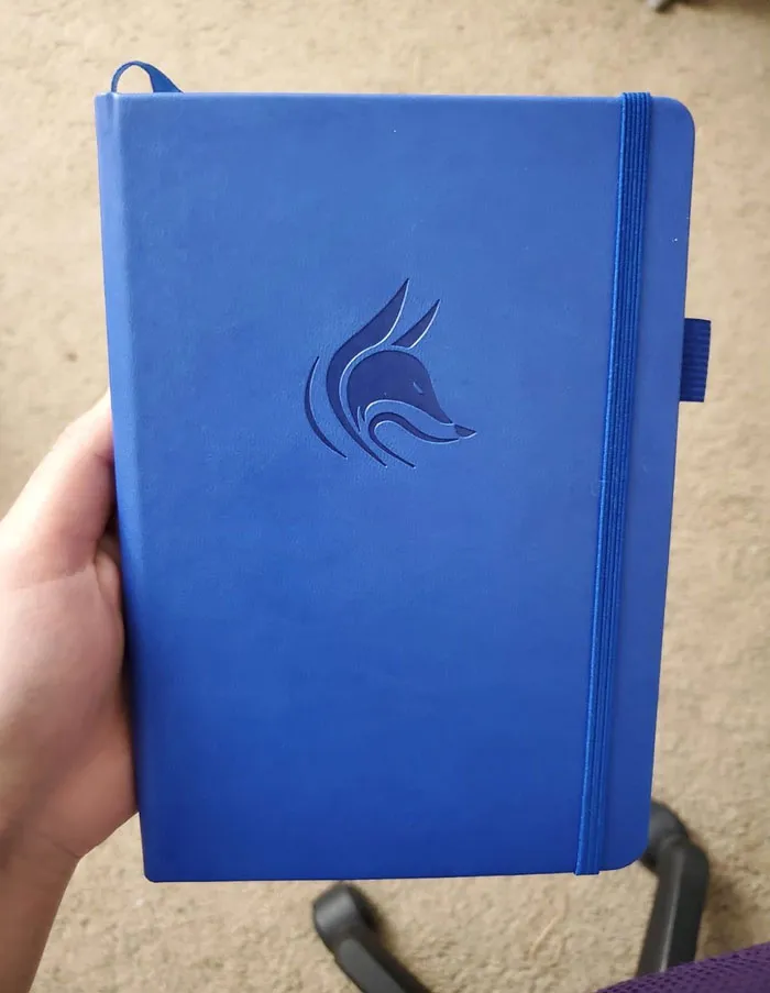 Blue notebook with a fox design, ideal as a Valentine's Day gift under $25.