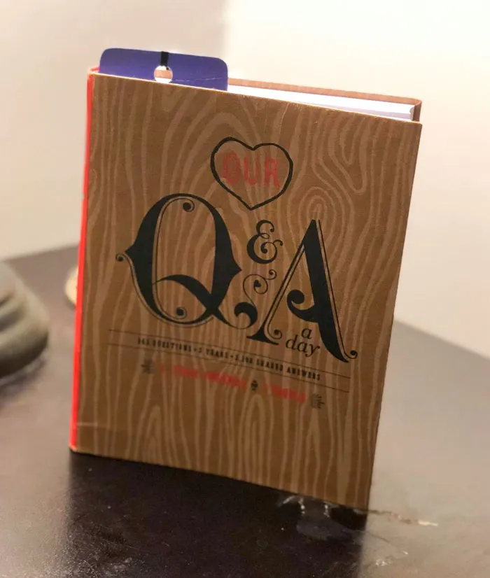 Valentine's Day gift idea: a Q&A a day journal with a wooden cover design, perfect for couples.