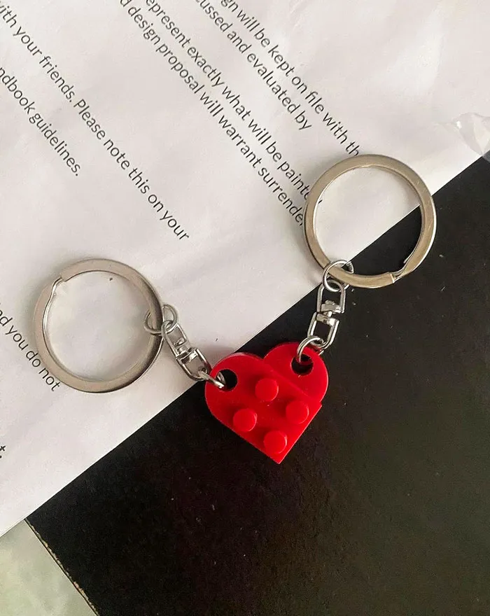 Cute, Quirky, And Undeniably Fun, These <a Style="Display:inline;" Href=" Https://Www.amazon.com/Dp/B0c68why1l?psc=1&pd_rd_i=b0c68why1l&pd_rd_w=t9xta&content-ID=amzn1.sym.0d1092dc-81bb-493f-8769-D5c802257e94&pf_rd_p=0d1092dc-81bb-493f-8769-D5c802257e94&pf_rd_r=kg147khhv6wyegtfa4qf&pd_rd_wg=595ge&pd_rd_r=0ea0ba9f-51ff-4f1e-8760-6a90c9adbb76&s=apparel&sp_csd=d2lkz2v0tmftzt1zcf9kzxrhawwy&linkcode=ll1&tag=bpsalmon-20&linkid=abcac0239b21ffac60fb21a0adb81060&language=en_us&ref_=as_li_ss_tl" Target="_blank"><span Style="Font:inherit;color:#d74b1f;"> Matching Heart Keychains</Span> Are The Playful Valentine's Day Gift Every Couple Needs