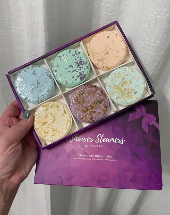 Box of colorful shower steamers, a budget-friendly Valentine's Day gift option.