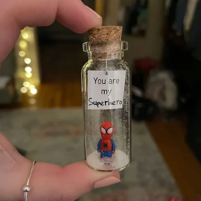 Valentine's Day gift under $25: a miniature superhero in a jar with "You are my Superhero" message.