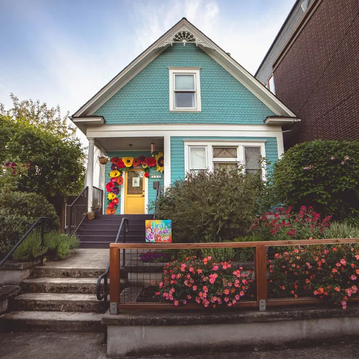 Blue house with small entrance and stairs