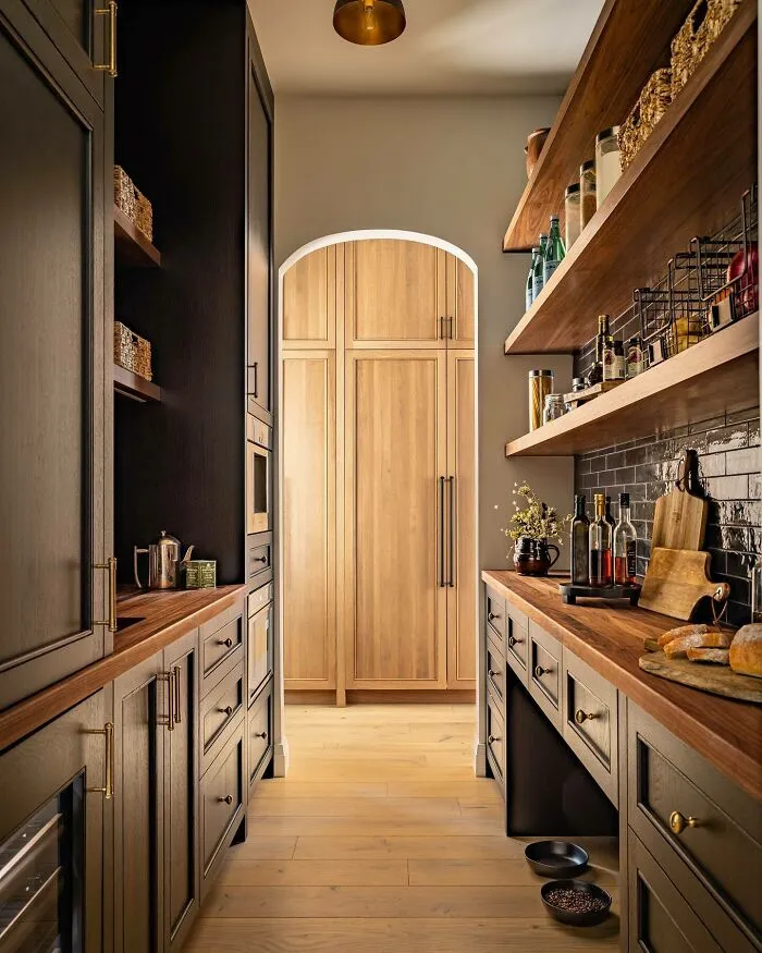 Play With Contrasts With Dark Cabinets And Wood Accents