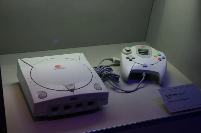 SEGA Dreamcast console and controller displayed as a failed "next big thing" in gaming history.