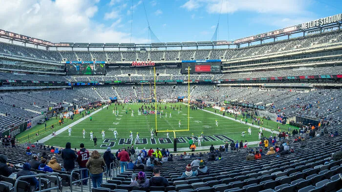 Sparse crowd at a stadium during a football game, highlighting a failed event once seen as the next big thing.