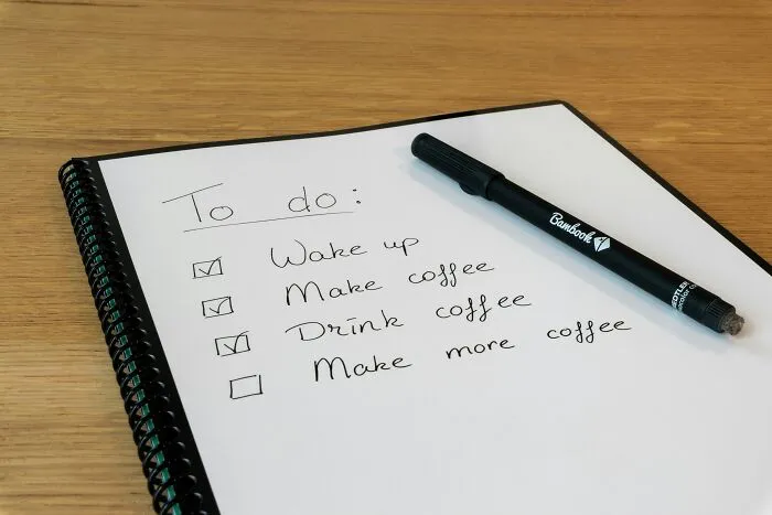 To-do list with humorous advice: wake up, make coffee, drink coffee, make more coffee.