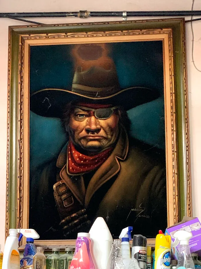 My Husband Bought This From A Mexican Restaurant That Closed In San Diego. Notice The Area Where The Spotlight Burned It. John Wayne Stares At Me With Disdain When I Do Laundry