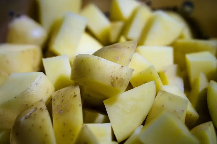 Chopped potatoes in close-up, showcasing practical advice on preparing vegetables.