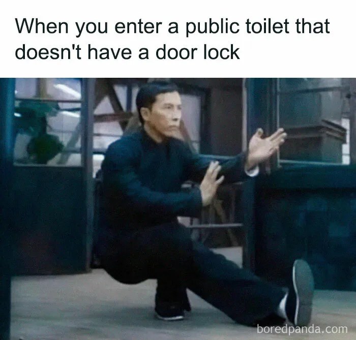 Martial artist humorously guards a door, illustrating introvert meme about door locks in public toilets.