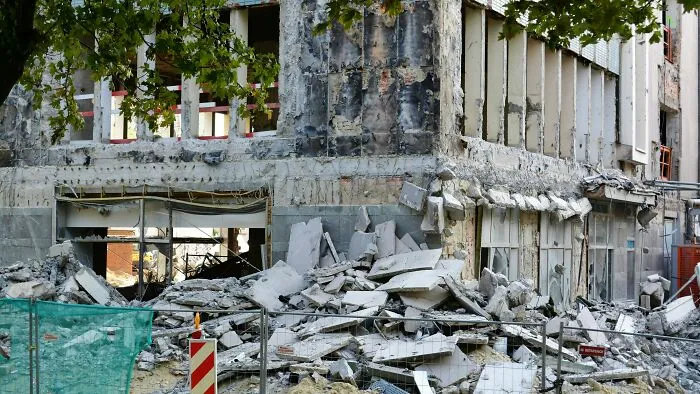 Gray concrete building after earthquake