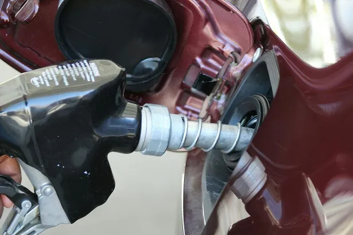 Person holding gas pump