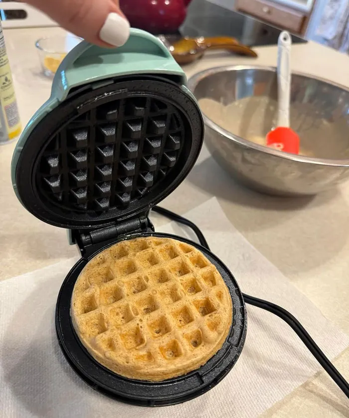 <a style="display:inline;" href="https://www.amazon.com/DASH-DMW001AQ-Individual-Chaffles-Non-Stick/dp/B01M9I779L?crid=1T5UXN1CZTWQQ&keywords=dash+mini+waffle+maker&qid=1707383013&refinements=p_72%3A1248915011&rnid=1248913011&s=home-garden&sbo=RZvfv%2F%2FHxDF%2BO5021pAnSA%3D%3D&sprefix=dash+mini%2Cgarden%2C1357&sr=1-2&linkCode=ll1&tag=bphamster-20&linkId=2417c135881e18384ad7e2a3cebe6c36&language=en_US&ref_=as_li_ss_tl" target="_blank"><span Style="Font:inherit;color:#d74b1f;"> DASH Mini Maker</Span>, The Breakfast Wiz You Didn't Know You Needed - From Waffles To Pizza Biscuits, It's A Game Changer For Your Cooking Routine