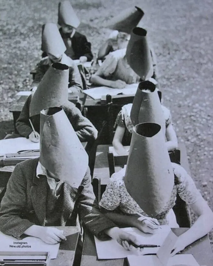 Anti-Cheating Hats From The 1900s 🧐
the Photo Was Taken On 10th Of June 1938 In UK .

facebook " Group " 
vintage / History Of Everything & Weird Facts

...................................

.
.
.
#anticheat #cheating #30s #student #exam #1930s  #students #weird #weirdvintage #weirdhistory #exams #nocheat #1938 #uk #olduk #vintageuk