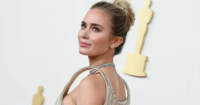 Emily Blunt’s New Video Has Internet Laughing After Backlash On Her Levitating Shoulder Dress