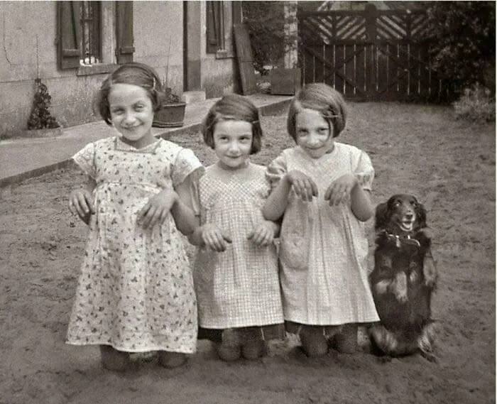 Three Young Girls And A Dog Pose For The Camera. 1930