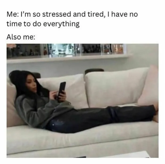 Person lounging on a couch using a phone, illustrating relatable moments in winning introverts memes.