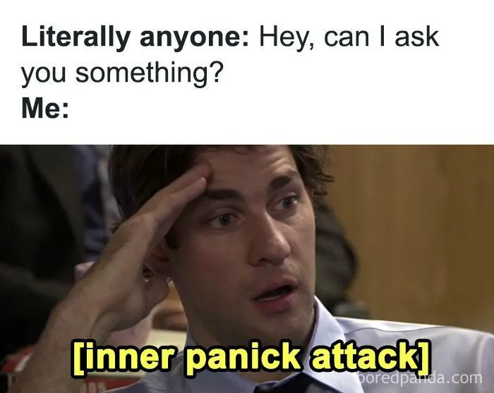 Man holding head with stressed expression and caption inner panick attack representing winning introverts relatable meme.