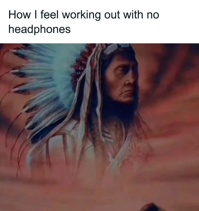 Man in a Native American headdress appears in a humorous gym meme about exercising without headphones.