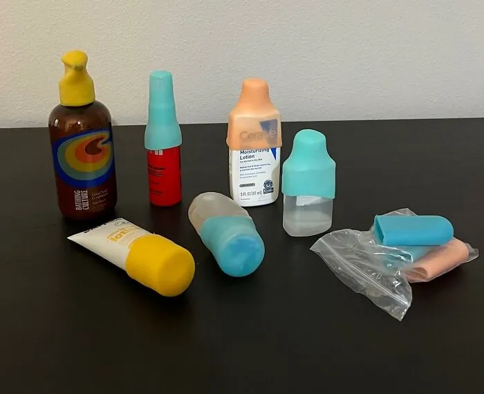 These <span Style="Font:inherit;color:#d74b1f;"> Silicone Bottle Covers </Span> Will Spare You Any Spillage While Traveling