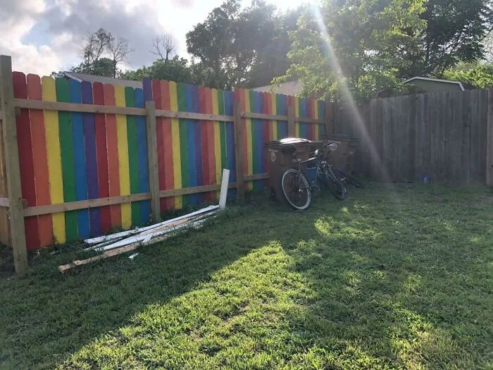 Rainbow Revenge: The Neighbor Cut Down The Flower Garden In Front Of My Fence Again So I Unscrewed Every Picket And Painted His Side. (Yes It's My Fence)