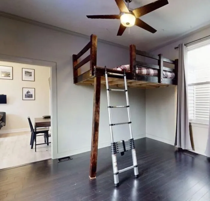 From A Local Listing (Technically Ladder And Not Stairs). Pitched As An Extra Bedroom…the Dining Room Is On One Side (With No Door), And The Only Entrance To The Actual Bedroom Is On The Opposite Wall.  Yes The Brace Pole Is That Slanted, And Yes The Fan Is Directly Above The Ladder.
