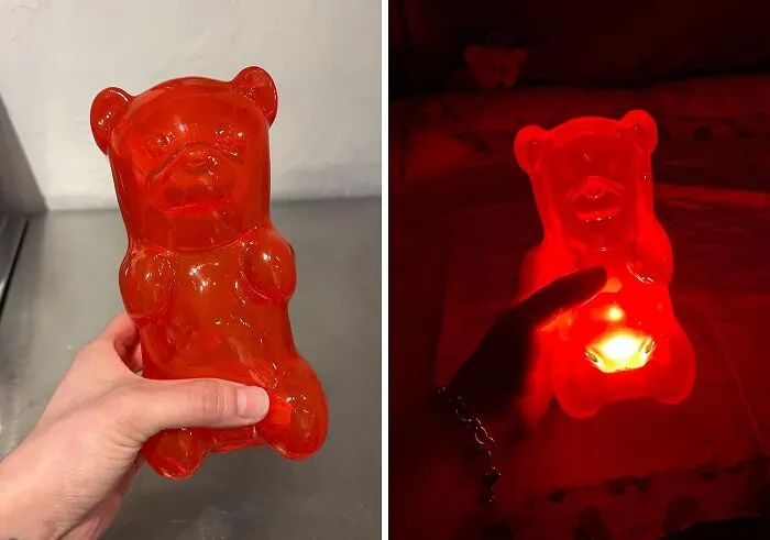 Red gummy bear-shaped candle holder glowing in the dark, highlighting a unique item from a collection of random things.