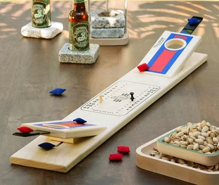 Bring The Fun Of Backyard Bbqs Indoors With A <a Style="Display:inline;" Href="Https://Www.uncommongoods.com/Product/Tabletop-Cornhole"_blank"><span Style="Font: Inherit; Color: #d74b1f;"> Tabletop Cornhole</Span> Set, The Perfect Way To Keep The Party Going Even When The Weather Doesn't Cooperate