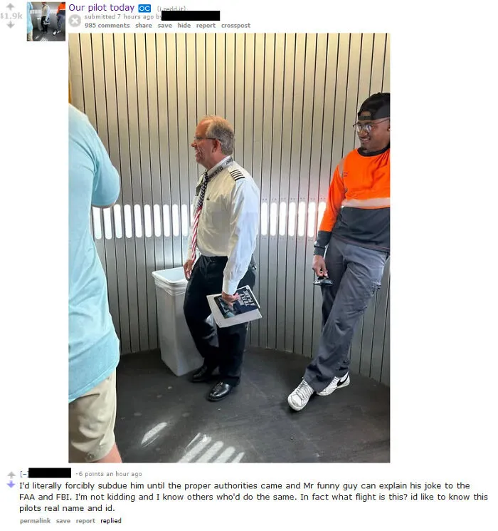 Pilot in uniform holding book standing near airplane door in tough guys post