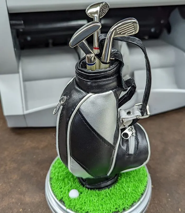 Most Hole-In-One Worthy: <a Style="Display:inline;" Href="Https://Www.amazon.com/Jishi-Coworkers-Organizer-Accessories-Birthday/Dp/B0b14svhqn?content-ID=amzn1.sym.b02cd478-BF8a-4028-A2ed-89cf0c172d2d%3aamzn1.sym.b02cd478-BF8a-4028-A2ed-89cf0c172d2d&dib=eyj2ijoimsj9.jnwrnhclnvnnsoaxpmi7m0nbrz0chradatb2028aphgs-9fq3n_xn_cexegjir_nqobojps6jk9n6jn2pzaou9tf5kozjbq7thn5tljtfd43a5y_bgsnbwrnqcztbgoxdk-Qiwxdnakmodjtqokuhwycgyysb50e9s133e-Bpbv2hgbmgkc3tqrtgqoufpxz1kytpdlobzxuxutuspqk6qhxk7zfoz7sbbuzubtfal0oz9pc78_3vchgg5cn4esrqs4dc1nryiarcw-Qytnbohwd2tmleb5gehogselgusk.ewcfn7rahthfzn5wba4fkwrk5nf5qtepak43plsmvfo&dib_tag=se&keywords=cool%2boffice%2bstuff&pd_rd_r=9a3e89bd-6109-44ea-Aaf6-04cb77d55e27&pd_rd_w=4alrc&pd_rd_wg=v3ksz&pf_rd_p=b02cd478-BF8a-4028-A2ed-89cf0c172d2d&pf_rd_r=dv9ssw514vz58v5fmr2x&qid=1722329358&sr=8-82&th=1&linkcode=ll1&tag=bpkomodo-20&linkid=88b443169baf78badc59cc0380accf46&language=en_us&ref_=as_li_ss_tl" Target="_blank"><span Style="Font: Inherit; Color: #d74b1f;"> Golf Bag Pen Holder</Span>
