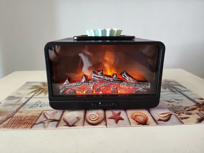 Bring The Cozy Ambiance Of A Fireplace To Any Room With The <a Style="Display:inline;" Href="Https://Www.amazon.com/Mepllivs-Fireplace-Electric-Monochromatic-Fragrance/Dp/B0bzslrcxk?crid=2ngqjxdmdvdj0&dib=eyj2ijoimsj9.waxv-Kstgsm-Unyjarl3blb_r2vav07et2cepapl-_xuh02aqpswl6fbg9nzekgoczzub7vv4g8qrjeoau7nmvw19q37rh0zwvvrluqjk142xsb9vrken5wtxzivigg2hyhfkxsuzvjo2j-6kkg73dvlxy9iysrvcnyyleldvoicraubb6gwf2syfmz8bqz23l9seqoulxt-Xxgu5hwel8ufzw8wlsqvxphnvkpvec5buoeeau8zwjl9hqe8staw0gblcr3laleso1id-Bh2ekews4xbg2wglognq9vq82s.hmgoxqzpicfyijhlidyeyn8u4dqhjkfhvrd2lc2q-Bo&dib_tag=se&keywords=cozy%2bhome&qid=1720180703&sprefix=cozy%2bho%2caps%2c283&sr=8-58&th=1&linkcode=ll1&tag=bppony-20&linkid=483d405eab35e406f16555b9f6abe6b3&language=en_us&ref_=as_li_ss_tl" Target="_blank"><span Style="Font: Inherit; Color: #d74b1f;"> Fireplace Electric Wax Melt Warmer</Span>, Minus The Hassle Of Wood And Ashes