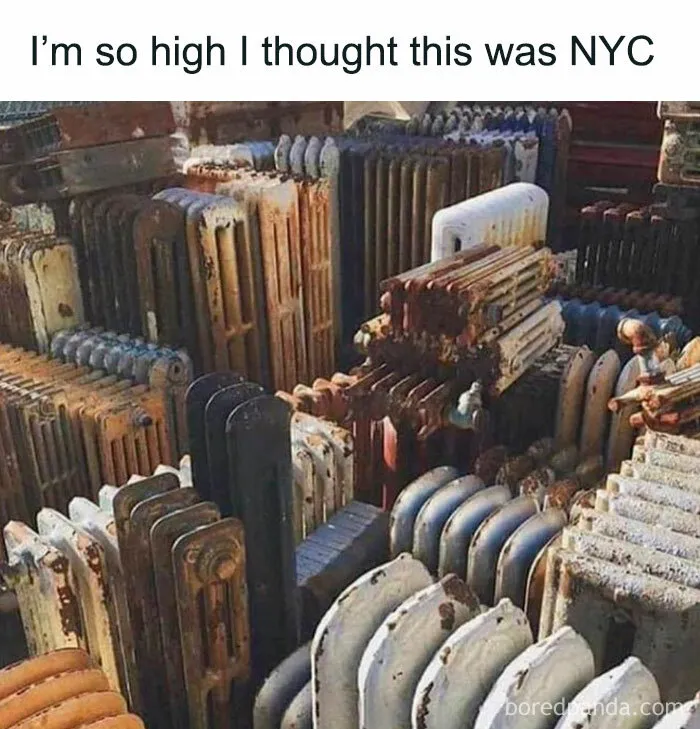 Old radiators stacked together, resembling a city skyline, with humorous meme text above.