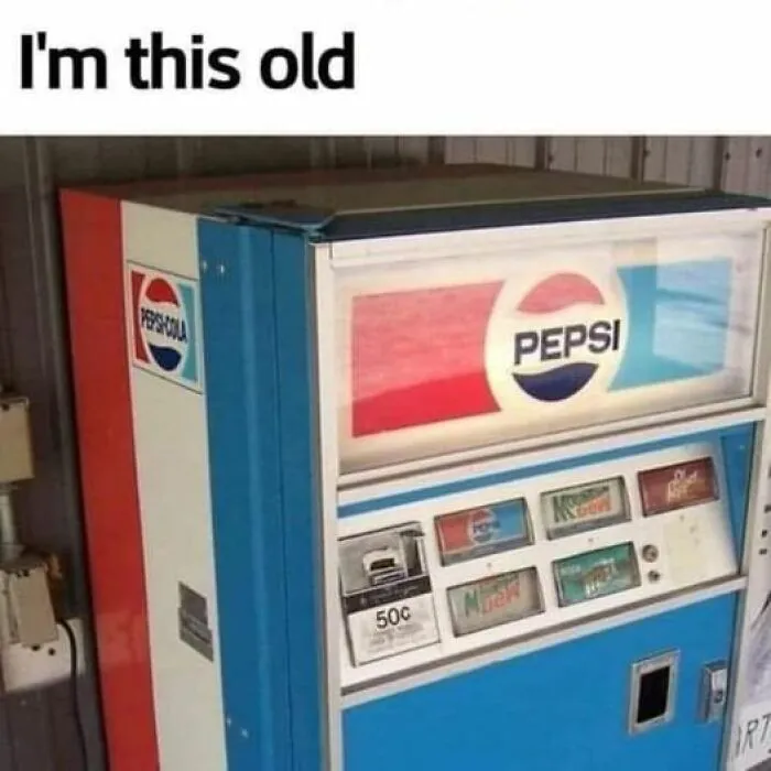 1990s Pepsi vending machine with vintage logo and 50-cent price, evoking nostalgic memories.
