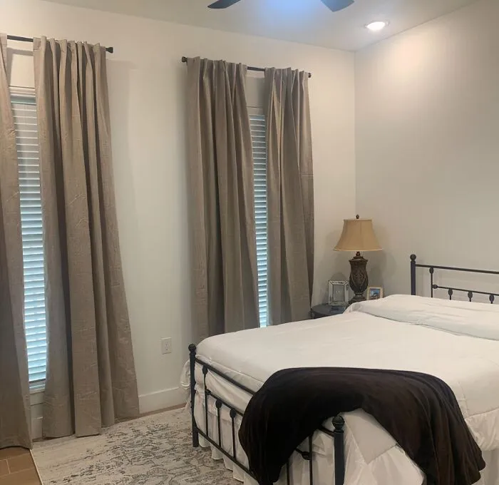 Choosing the perfect window treatments involves more than just aesthetics. Consider your lifestyle and sleep preferences: If you need complete darkness for a restful slumber, opt for <a style="display:inline;" href="https://www.amazon.com/Joydeco-Curtains-Blackout-Darkening-Insulated/dp/B0BZDLT95R?crid=39ZL6USI8N5SK&dib=eyJ2IjoiMSJ9.nO2kHR2oe-D776BcEWo1AiRzgsYwdJhxbeRSEJYFvu2a3zfvhbjTOPVqOW6pbFVGMAgHdhFqcvmZniQNmZFaq4btCNhur5mG5ijfivVeOkkAbViNf-Pvj0pn9affKBxdh8BBEgFIvs1rp2pVWKxJAqqhWoYY4sU0qE4-ruDFphpe8PkuTuII1H6o0fiyGm7rHUaBZZ7W73c4dZjZ1GwHOg7JZ2wI8T-7AUwMne5iAFQ7_QUv39Jw8b65a_MwLMfWd7g2aDYBV9sk7UuVKcmn8C9jrt4dPn_XuiH5flLwd1g.4XyUfbymnCQ-wfTIYgHnNDum7ncflV7_yGWEPAq6rgQ&dib_tag=se&keywords=blackout%2Bcurtains&qid=1723183550&sprefix=blackout%2Caps%2C789&sr=8-2-spons&sp_csd=d2lkZ2V0TmFtZT1zcF9hdGY&th=1&linkCode=ll1&tag=bpcamel-20&linkId=3e19e74922113d3a8bd66c8c35968f5f&language=en_US&ref_=as_li_ss_tl " target="_blank"><span style="font: inherit; color: #d74b1f;">blackout curtains</span>. On the other hand, if you prefer a gentle wake-up call from the morning sun, consider lighter fabrics or blinds that allow some diffused light to filter in.