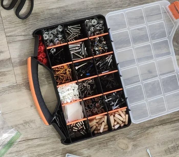 Repurpose a <a style="display:inline;" href="https://www.amazon.com/Massca-Hardware-Storage-compartments-Excellent/dp/B07GN29LXD?content-id=amzn1.sym.73b3a002-bc15-4db6-aa39-62f45d9e7e0d%3Aamzn1.sym.73b3a002-bc15-4db6-aa39-62f45d9e7e0d&crid=I3ZJ77WMQCFW&cv_ct_cx=smart-looking+tool+boxes&dib=eyJ2IjoiMSJ9.JbytX2tcOQasl4CB85lXMxYeZPzX2NlKHDbnzwNNKleAvyGqFc06_Y6Y_Lcj9jYA.lPg74ScawucwOVQ_NrvWHoy3fYc0hH1eKiaTrT_HDJ8&dib_tag=se&keywords=smart-looking+tool+boxes&pd_rd_i=B07GN29LXD&pd_rd_r=aa894a55-3003-4065-b0c0-36ee3516dc5d&pd_rd_w=V5ujv&pd_rd_wg=jJtXo&pf_rd_p=73b3a002-bc15-4db6-aa39-62f45d9e7e0d&pf_rd_r=GBT8RZF4DRCDYAJASKSN&qid=1723185638&sbo=RZvfv%2F%2FHxDF%2BO5021pAnSA%3D%3D&sprefix=smart-looking+tool+boxes+ki%2Caps%2C943&sr=1-3-364cf978-ce2a-480a-9bb0-bdb96faa0f61-spons&sp_csd=d2lkZ2V0TmFtZT1zcF9zZWFyY2hfdGhlbWF0aWM&psc=1&linkCode=ll1&tag=bpcamel-20&linkId=ea16fcfd2da38f324cf24ef89e247404&language=en_US&ref_=as_li_ss_tl " target="_blank"><span style="font: inherit; color: #d74b1f;">tool box</span> to wrangle tiny treasures! Forget flimsy plastic bins. A sturdy and stylish toolbox is perfect for keeping those small toys, art supplies, and other odds and ends organized and contained. It's a practical and visually appealing storage solution that adds a touch of industrial chic to any space.