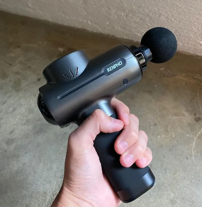A <a Style="Display:inline;" Href="Https://Www.amazon.com/Powerful-Portable-Renpho-Percussion-Handheld/Dp/B085ntr26k?ie=utf8&linkcode=ll1&tag=bpdolphin-20&linkid=d068be55f12a3ae3b7f4205df4413e88&language=en_us&ref_=as_li_ss_tl"_blank"><span Style="Font: Inherit; Color: #d74b1f;"> Massage Gun</Span> Isn't Just A Gadget, It's A Personal Masseuse That Fits In Your Gym Bag, Ready To Knead Away Those Knots And Leave You Feeling Like A Million Bucks