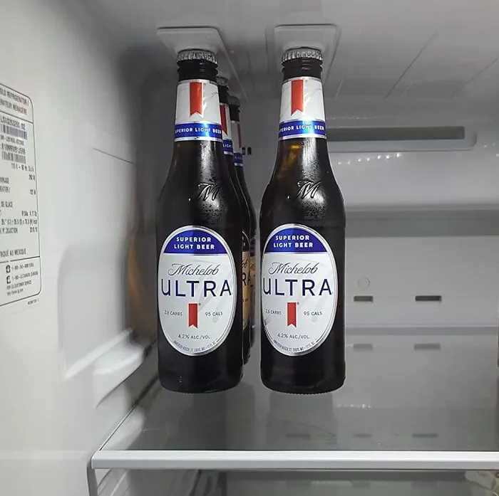This   <a Style="Display:inline;" Href="Https://Www.amazon.com/Bottleloft-Strong-Like-Bull-Magnets/Dp/B01kfzfbki?ie=utf8&linkcode=ll1&tag=bporca-20&linkid=ea8b8061c6c72718a1f3d90a12ef3bbb&language=en_us&ref_=as_li_ss_tl " Target="_blank"><span Style="Font: Inherit; Color: #d74b1f;"> Bottleloft Magnetic Bottle Hanger</Span> Is The Fridge-Top Real Estate Agent Your Beverages Have Been Waiting For, Freeing Up Valuable Shelf Space And Turning Your Fridge Ceiling Into A Gravity-Defying Display Of Drinks
