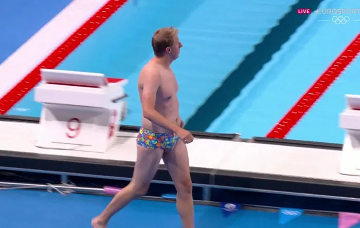 Random Lifeguard Became An Unexpected Hero After Saving The Day By Retrieving Lost Cap In Colorful Trunks