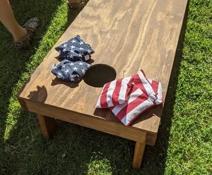 This <a Style="Display:inline;" Href="Https://Www.amazon.com/Cornhole-Weather-Games-Regulation-Weight-Stripes/Dp/B075438dw9?_encoding=utf8&content-ID=amzn1.sym.fa822bf8-045d-4990-A903-E39b011b2bbe&dib=eyj2ijoimsj9.uqbp0ipzjupgdbvxjaq-Wfffr71vwo51wfnluqihhhiyzal1utnqtjxh6sp2sarbjg0wvf-O9uazoekqwabikrvr22tkg1clkzu3epsevzktkpdheh6blxw6on7-Nlla2loz6mcyw33tmquw3kjynmsisgku15i31hitsj7c6rgxwpvokn-P9xap-4kk_fwmor8fbuideijd7e1lwliia0v0_j0s-Wx2quca47zoqexvt0nsl1_xmr5mxxcmqe4yhgf4gd6acp9my4k0uiamzfp6rwyb7bbkrso94gnbksm.idqnz7vhc0cxh1evunxzw7promwl-44soesgui5bchq&dib_tag=se&pd_rd_r=43714639-D3d3-4f7c-Ada2-2facbcb2b9cf&pd_rd_w=gzyzd&pd_rd_wg=osvoy&pf_rd_p=fa822bf8-045d-4990-A903-E39b011b2bbe&pf_rd_r=gth1dnrpn6w734kdanfr&qid=1724844057&refinements=p_36%3a-4000&s=sporting-Goods&sr=1-6&th=1&linkcode=ll1&tag=bpsheep-20&linkid=6582a18207f101240ed25c6fca9801bb&language=en_us&ref_=as_li_ss_tl" Target="_blank"><span Style="Font: Inherit; Color: #d74b1f;"> Cornhole Bags Set</Span> Is The Perfect Excuse To Gather Friends, Fire Up The Grill, And Enjoy Some Good Old-Fashioned Outdoor Fun