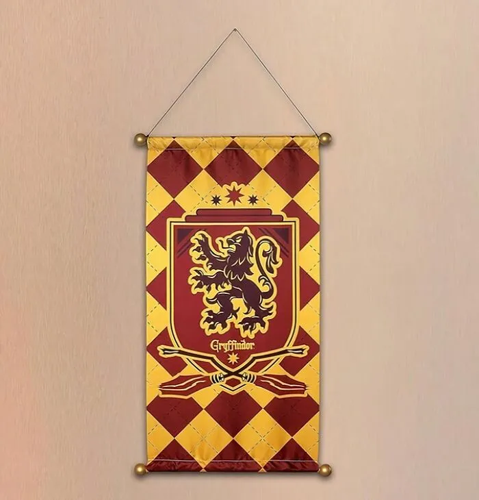 Show Your Hogwarts Pride Loud And Proud With This <a Style="Display:inline;" Href="Https://Www.amazon.com/Rubies-Potter-Hogwarts-Plastic-Gryffindor/Dp/B0bwcxn1xd?th=1&linkcode=ll1&tag=bprhinoceros-20&linkid=81d8a3bd5cd77b0fb77de2a8d41b9422&language=en_us&ref_=as_li_ss_tl" Target="_blank"><span Style="Font: Inherit; Color: #d74b1f;"> Gryffindor House Banner</Span> - It's The Perfect Way To Turn Your Room Into A Cozy Corner Of The Gryffindor Common Room!