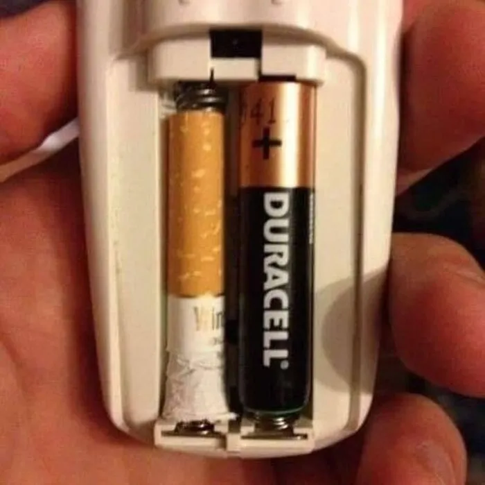 A weird setup with a cigarette and a Duracell battery in a device.