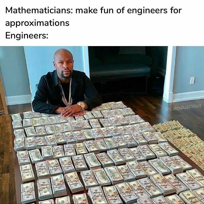 Engineer sitting behind a table covered with stacks of cash, humorous meme.