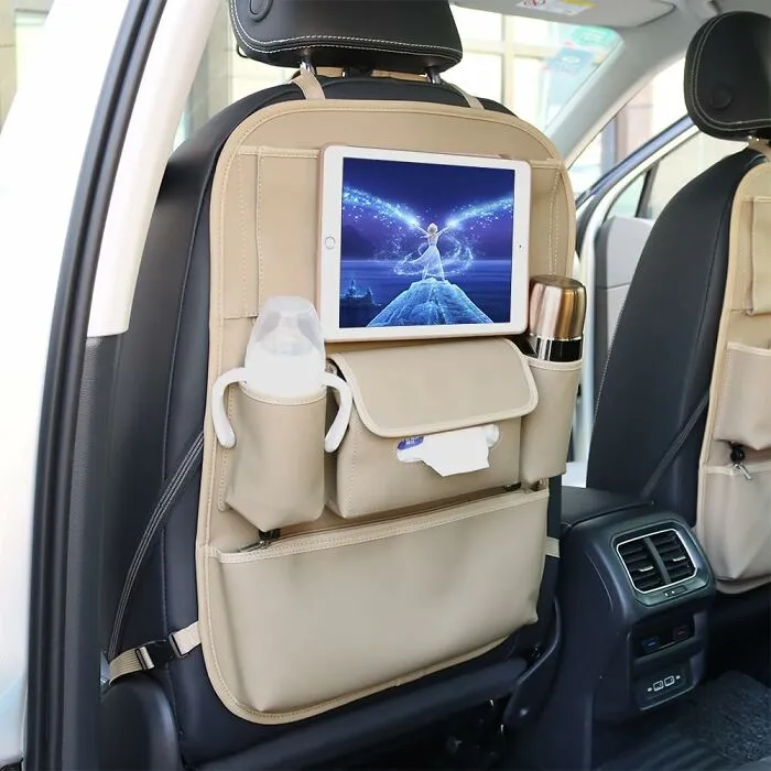 Your Backseat's About To Go From 'Disaster Zone' To 'Organized Oasis'! These <a Style="Display:inline;" Href="Https://Www.amazon.com/Dp/B07wz9w1qx?asc_item-ID=amzn1.ideas.1i2cakmaozu4v&th=1&linkcode=ll1&tag=bpgoose-20&linkid=2cf79241f6bbe8b04cc81d9491eb6ffd&language=en_us&ref_=as_li_ss_tl" Target="_blank"><span Style="Font: Inherit; Color: #d74b1f;"> Leather Kick Mats With Storage Pockets</Span> Will Protect Your Seats And Keep All Those Road Trip Essentials Within Reach