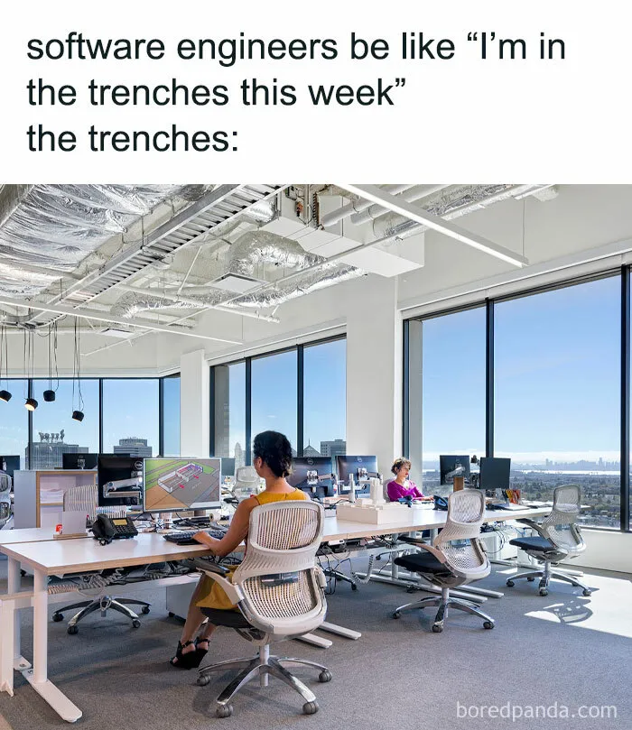 Open office with engineers at desks, illustrating a humorous take on their profession.